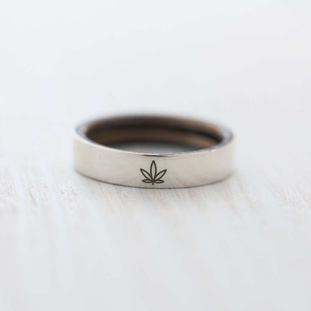 Ganja leaf engraving on silver & wood skateboard ring - BoardThing